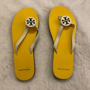 7M Tory Burch flip flops. Small tear in left outer shoe see photo)
